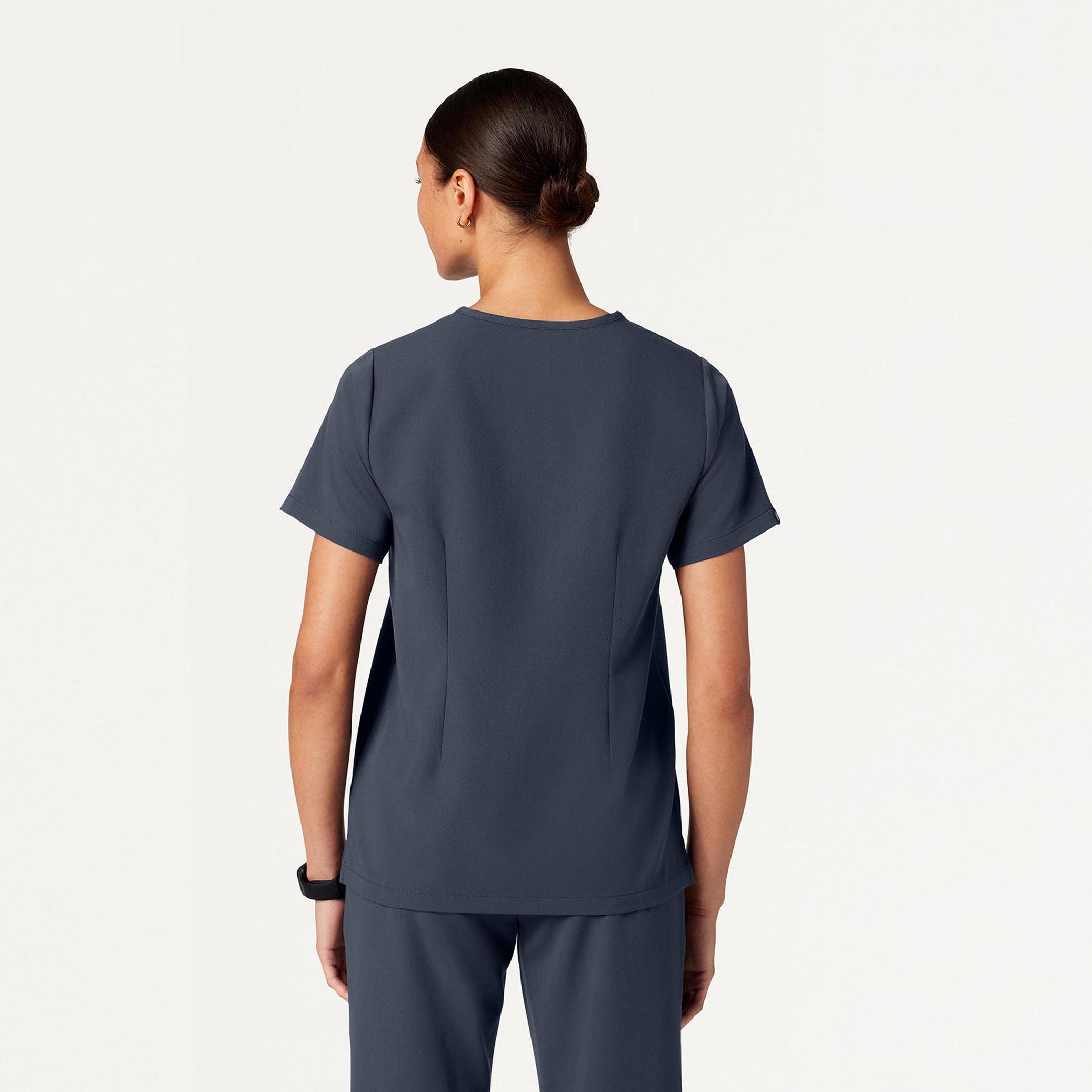 Woman wearing Carbon Gray scrubs