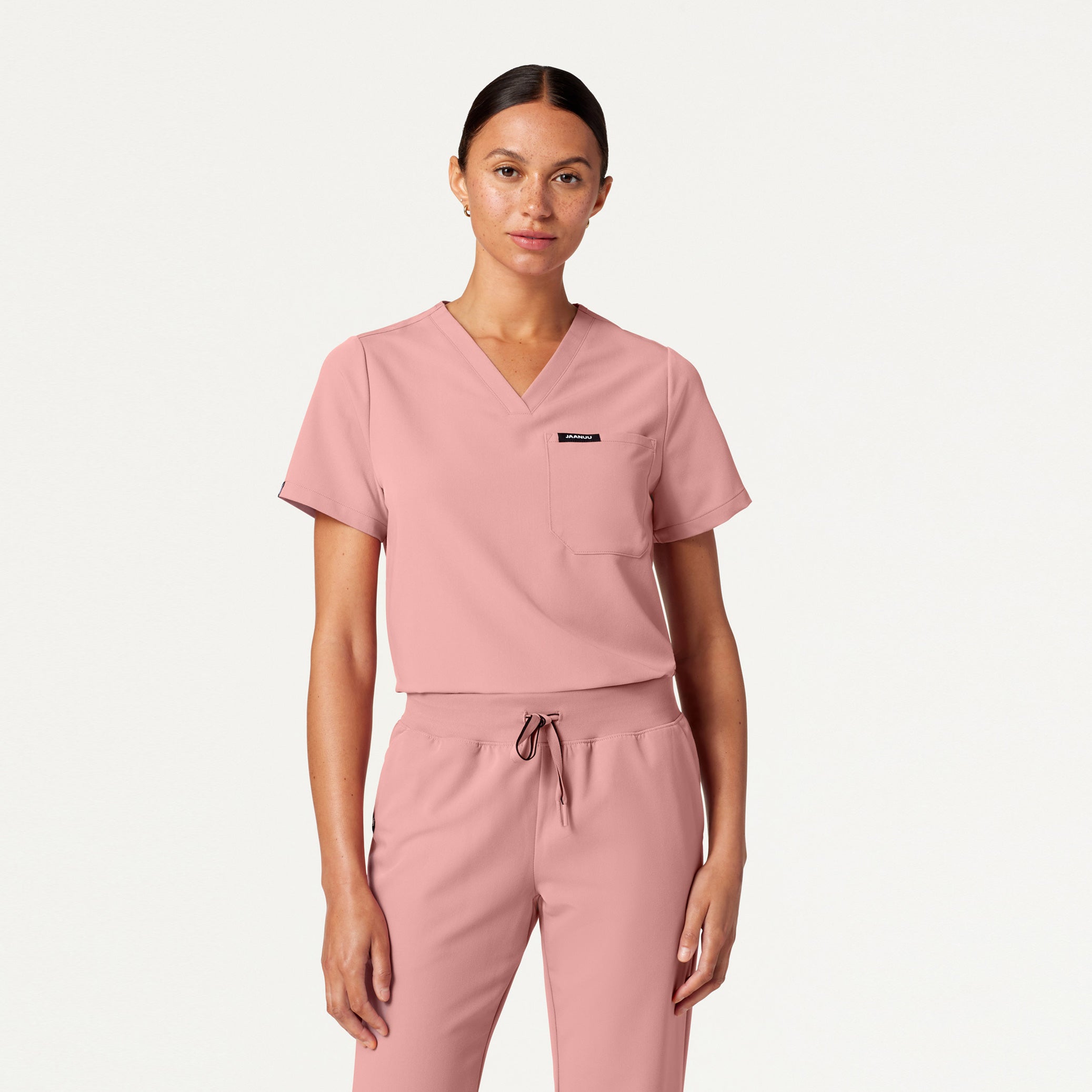 Woman wearing Mauve scrubs