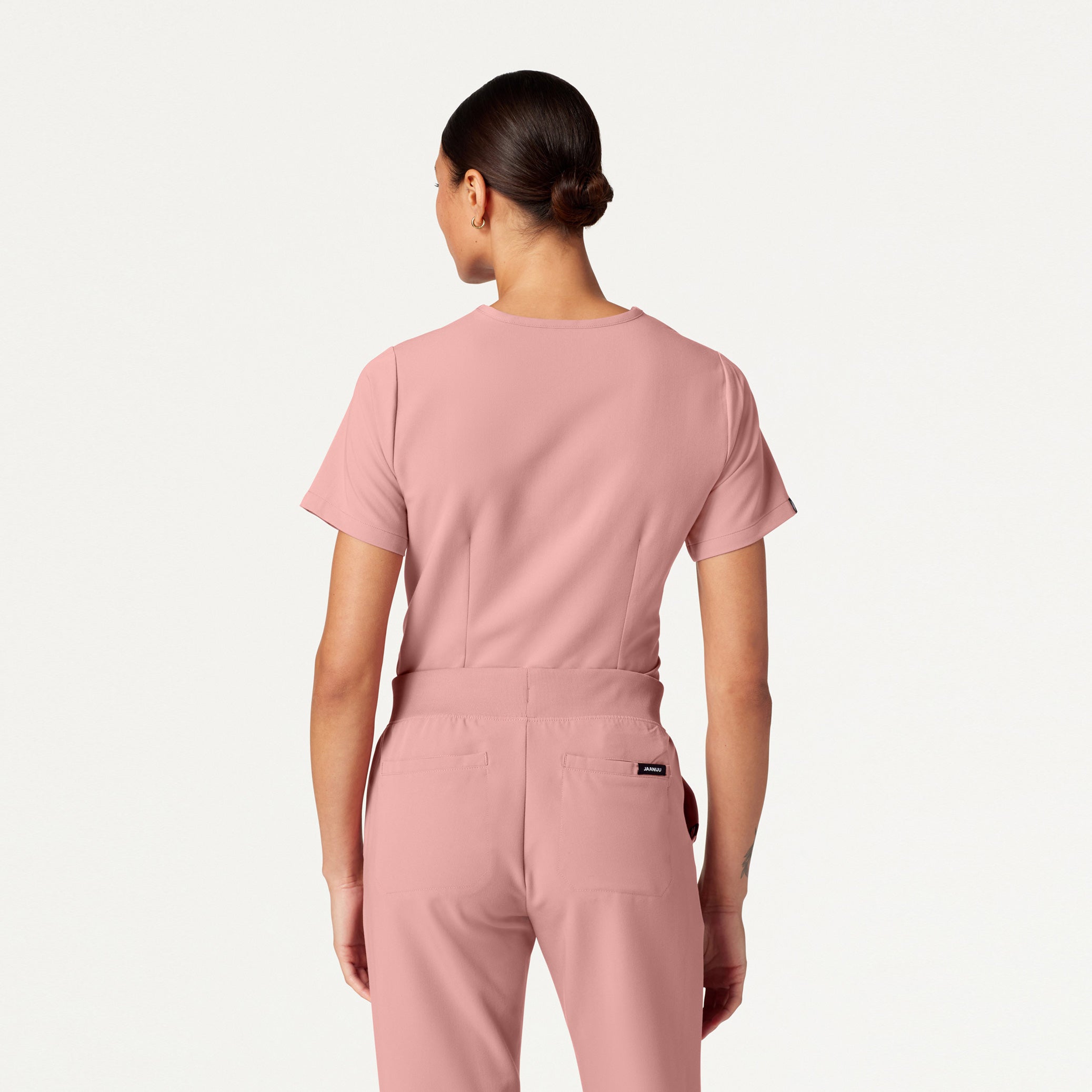 Woman wearing Mauve scrubs