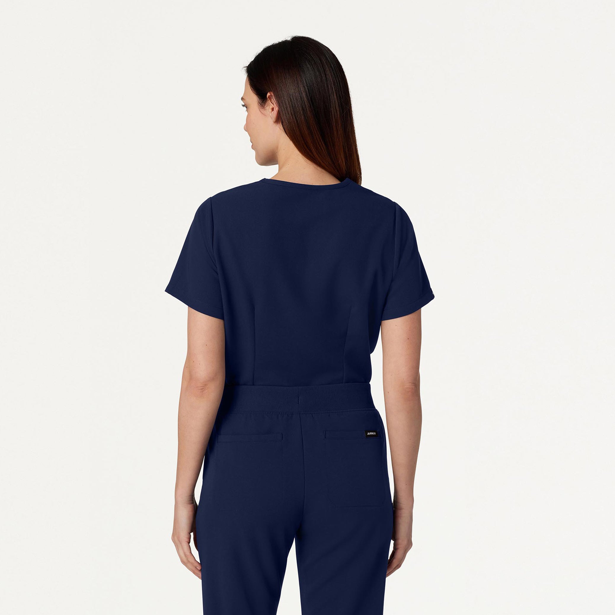 Woman wearing Midnight Navy scrubs