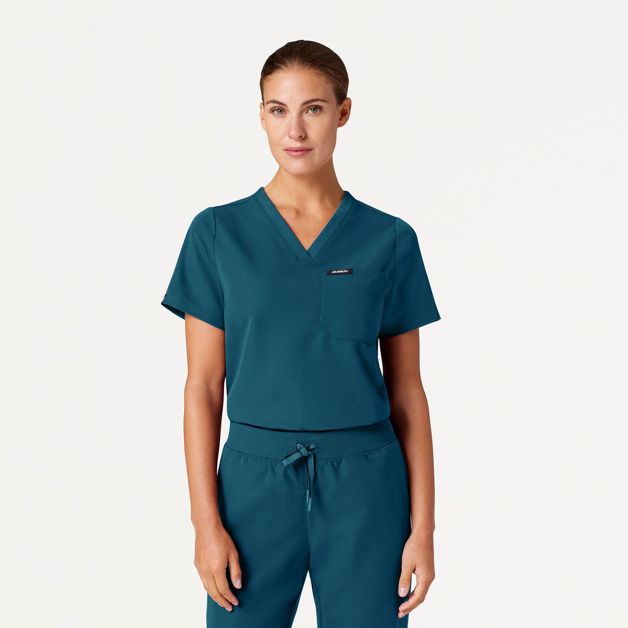 Woman wearing a Caribbean Blue scrub top