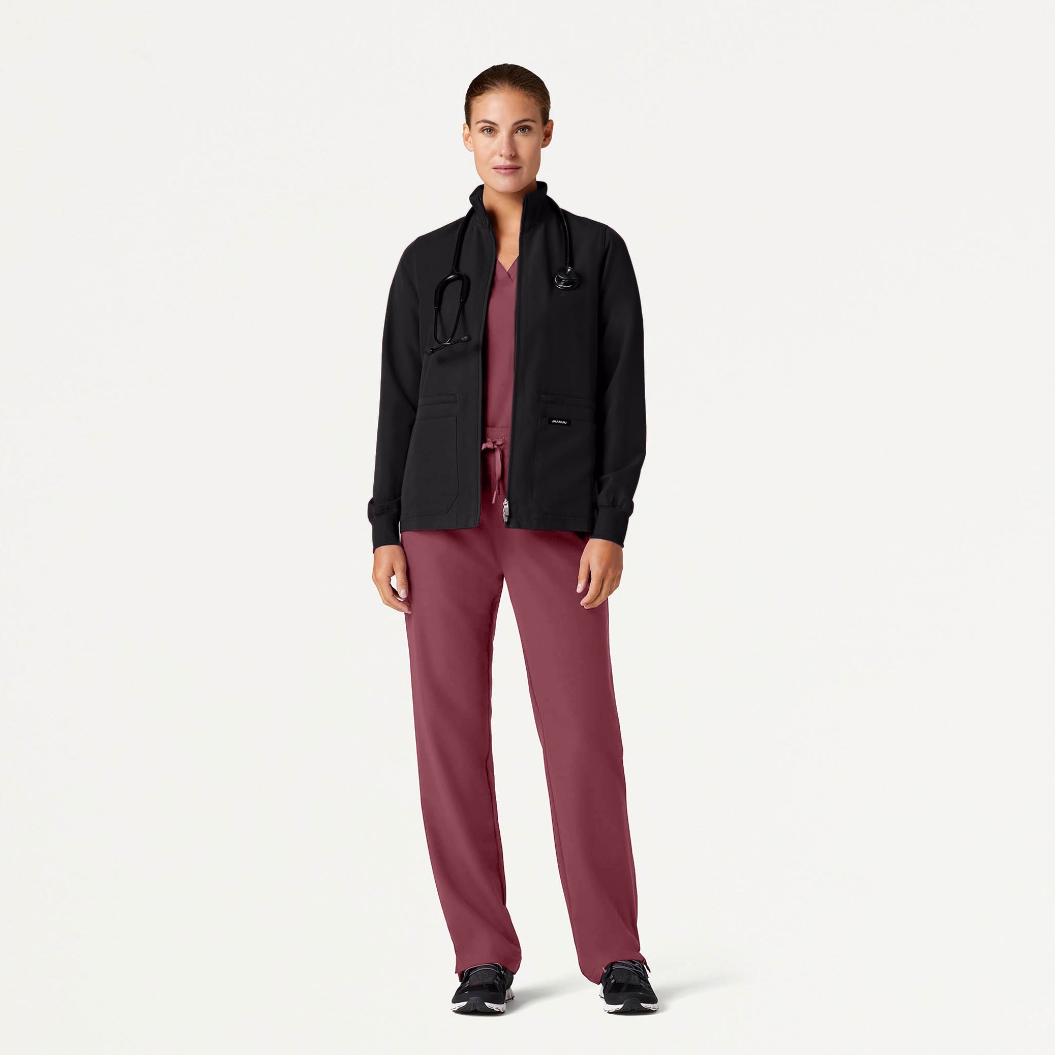 Woman wearing Rosewood scrub set with jacket