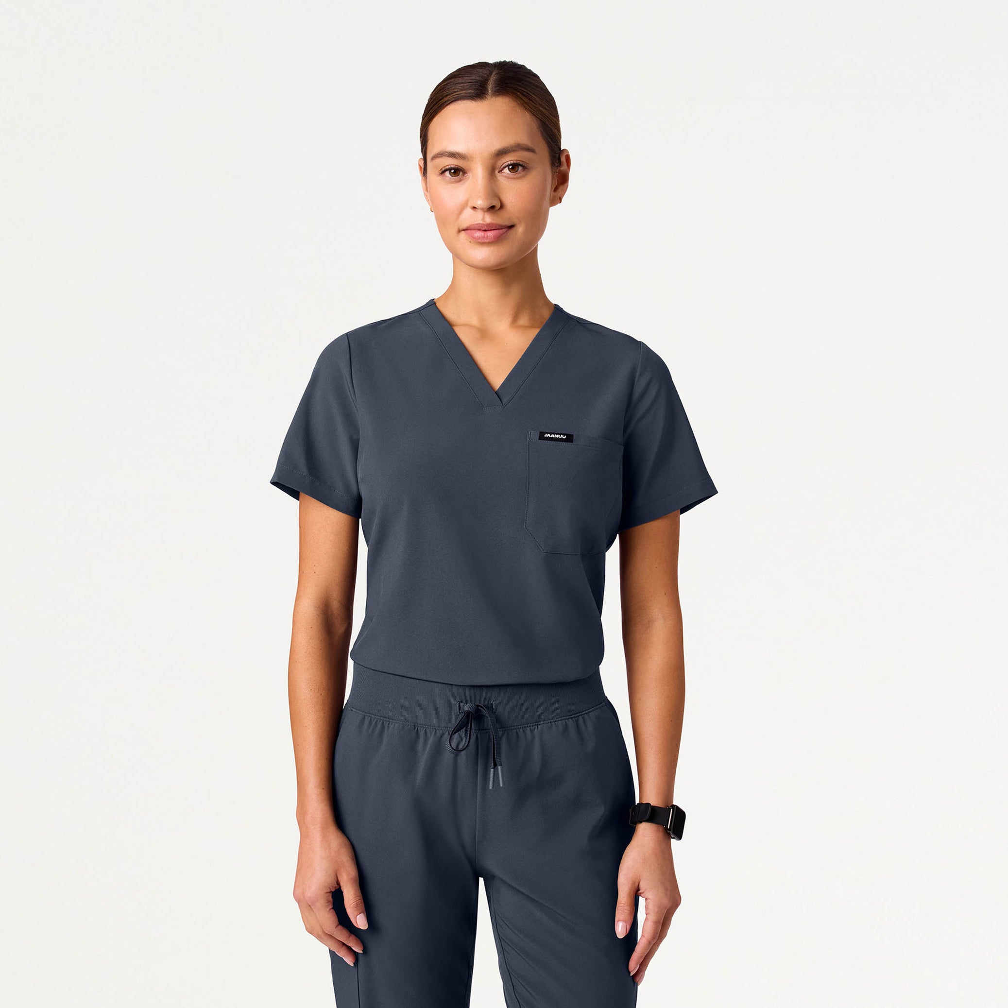 Woman wearing Carbon Gray scrub top