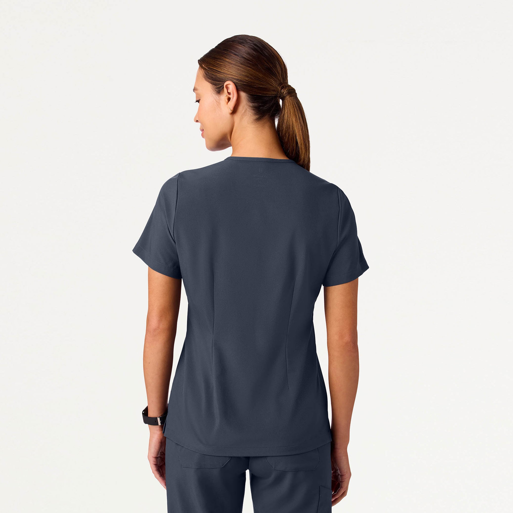 Woman wearing Carbon Gray scrub top