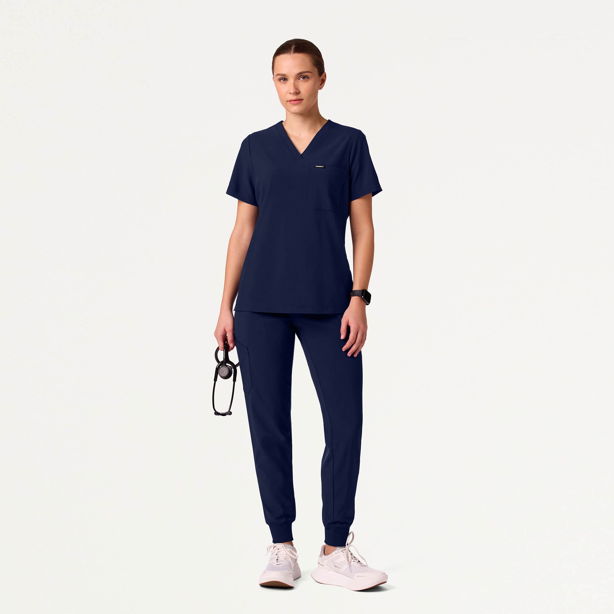 Woman wearing navy scrub set