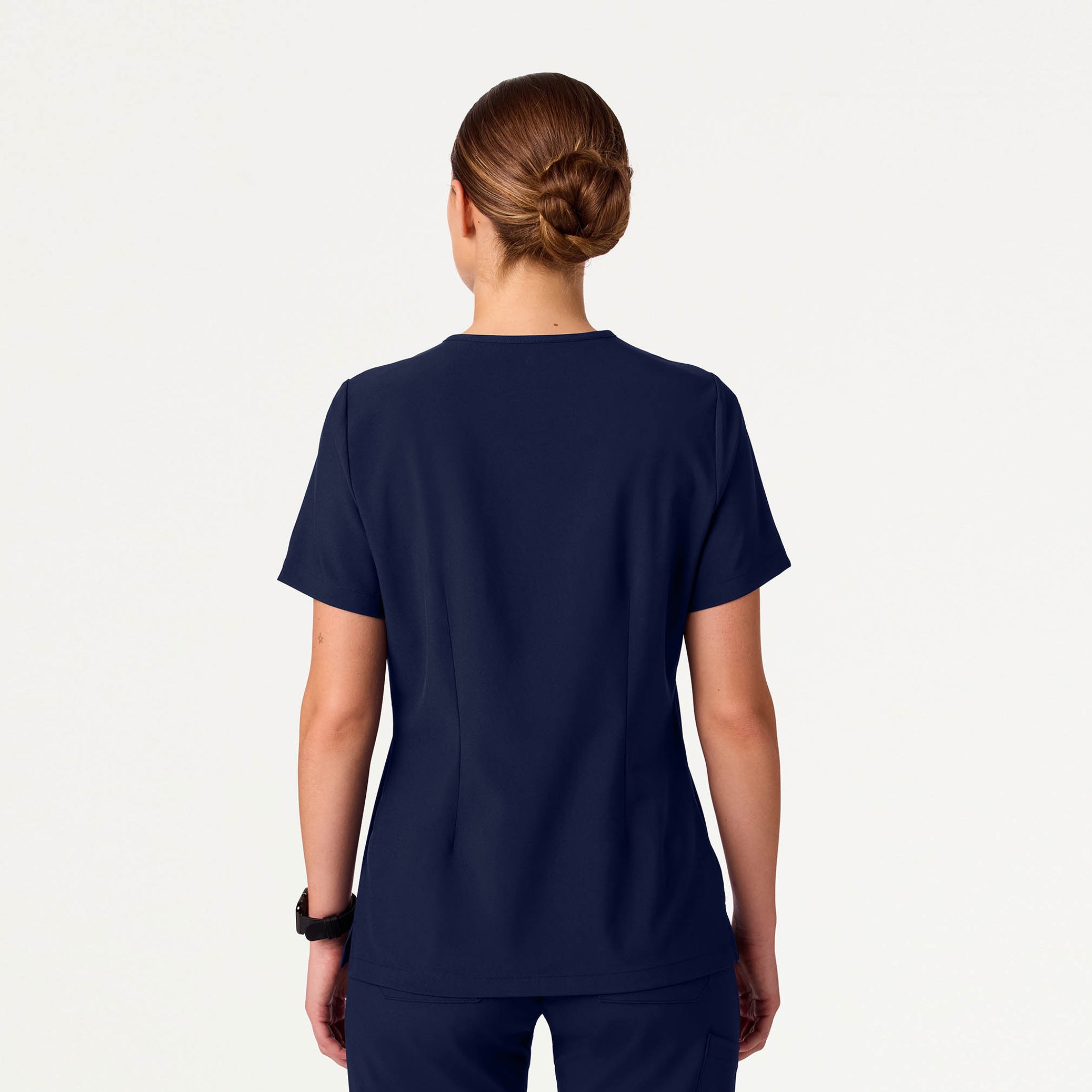 Woman wearing navy scrub top