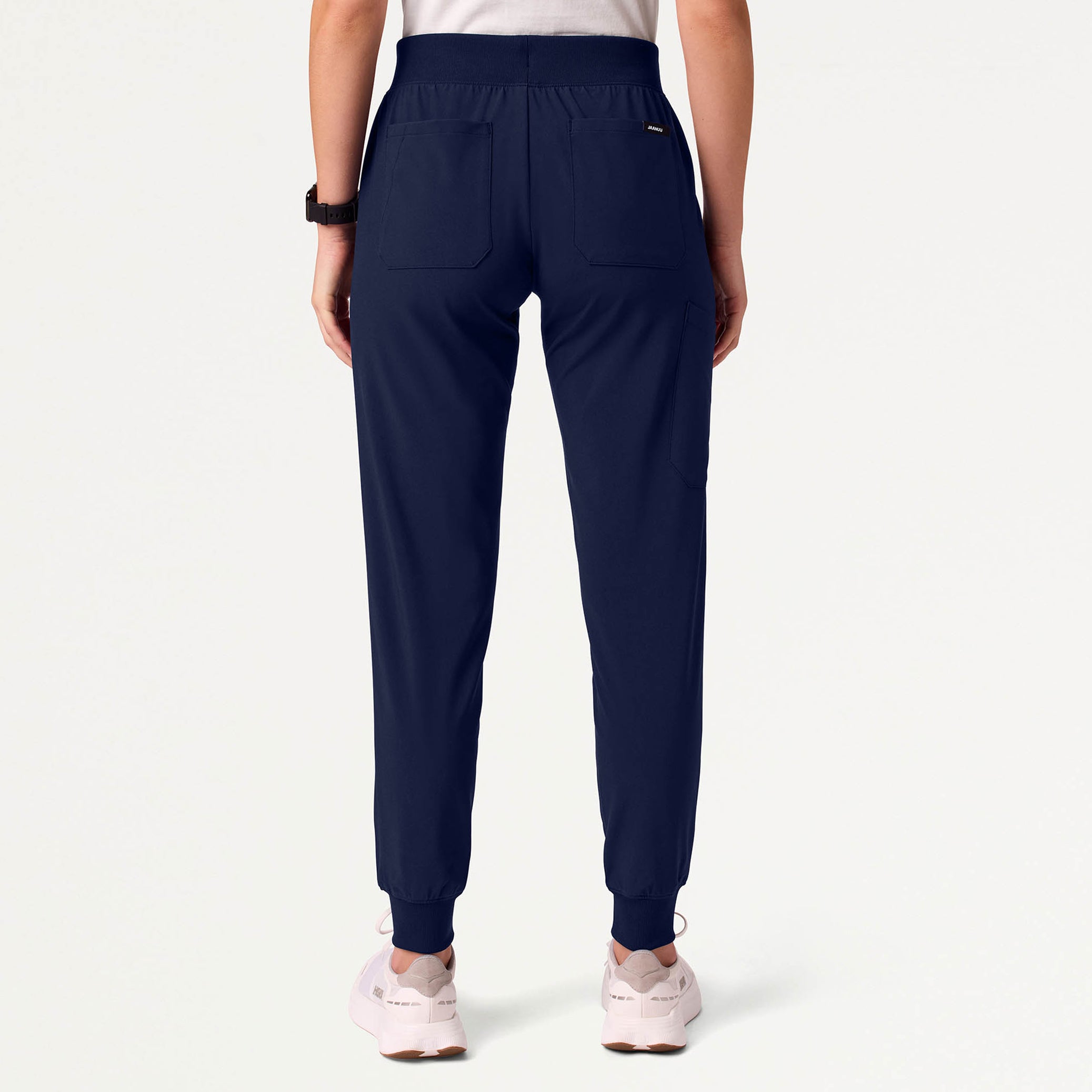 Woman wearing navy scrub pant