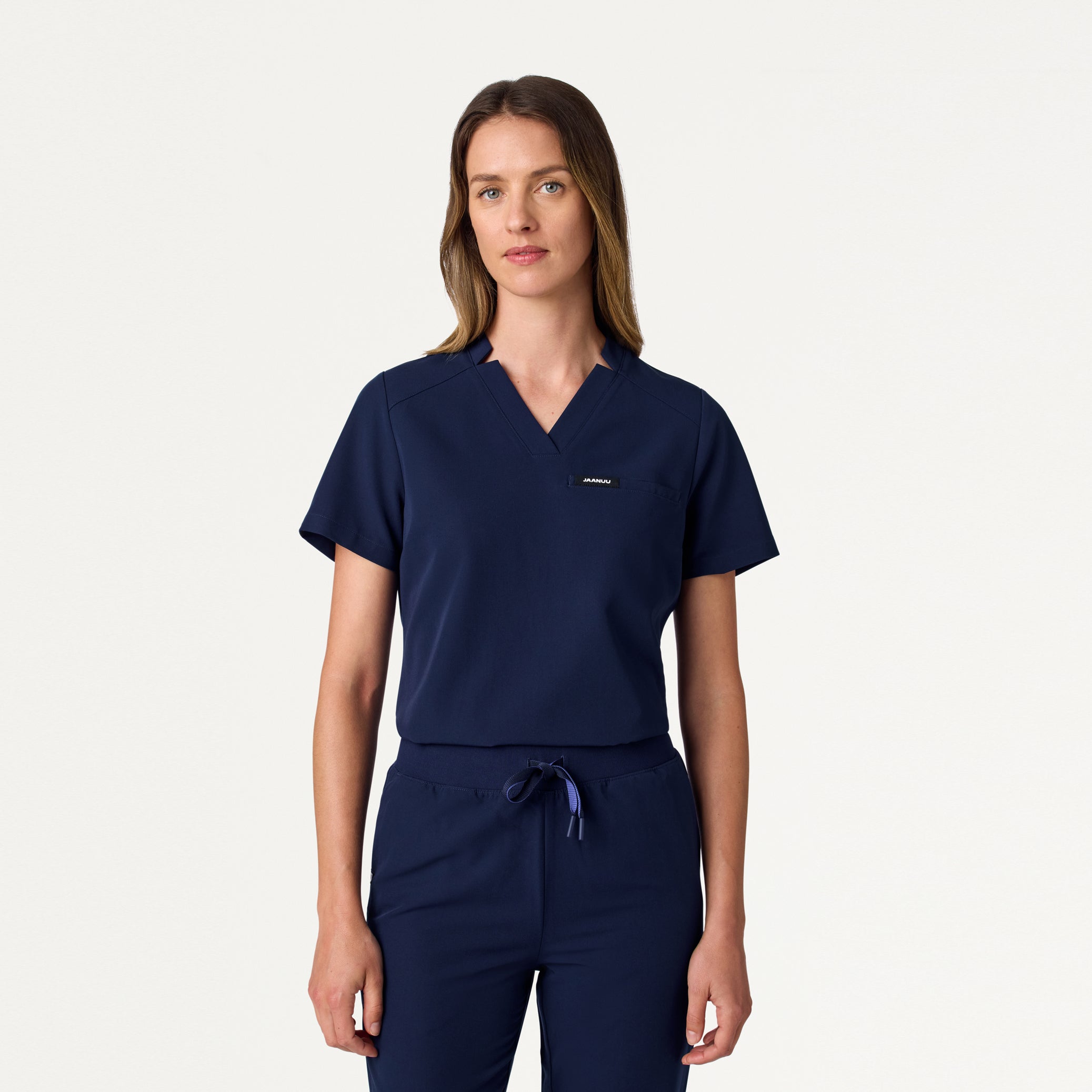 Woman wearing Midnight Navy scrub top.