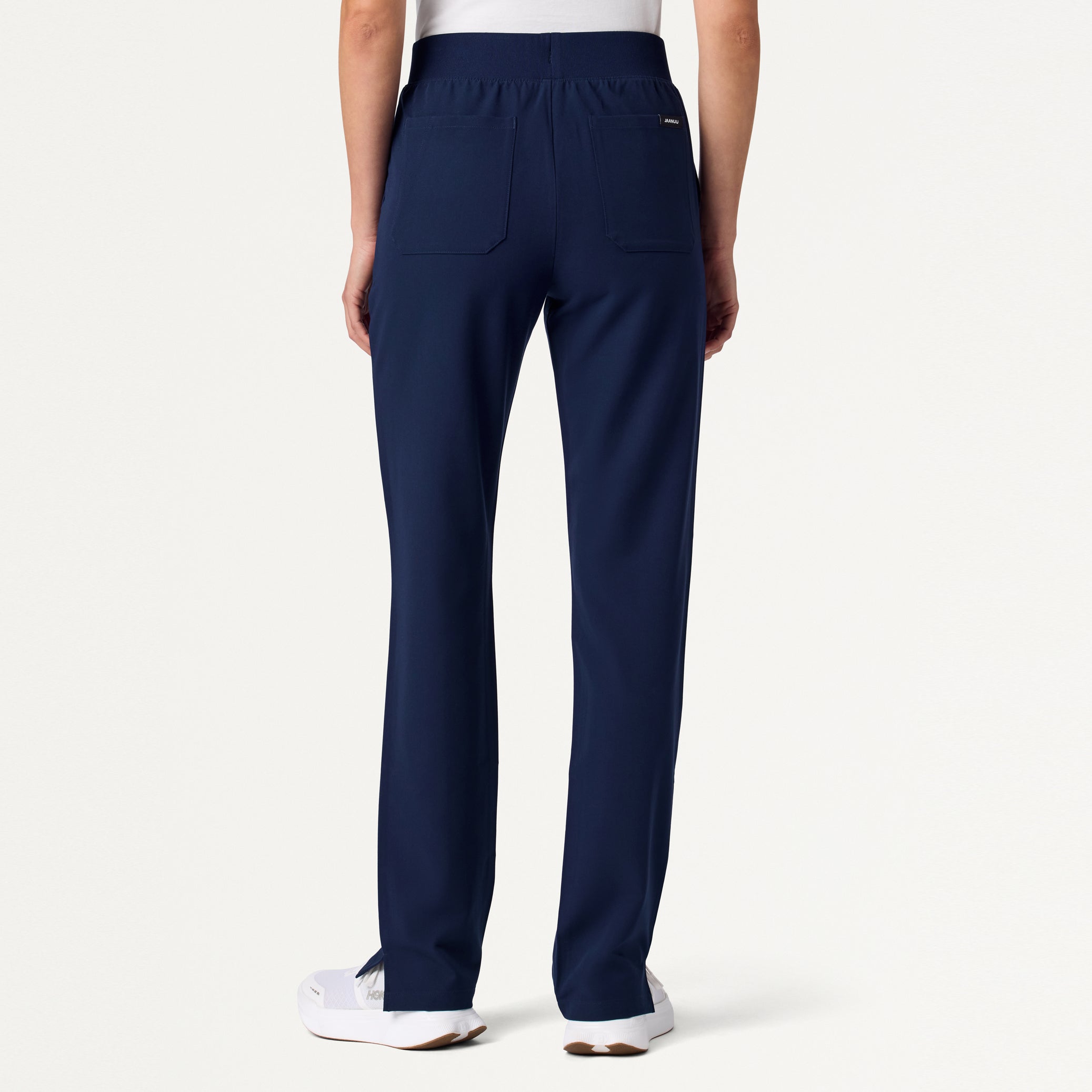 Woman wearing Midnight Navy scrub pant.