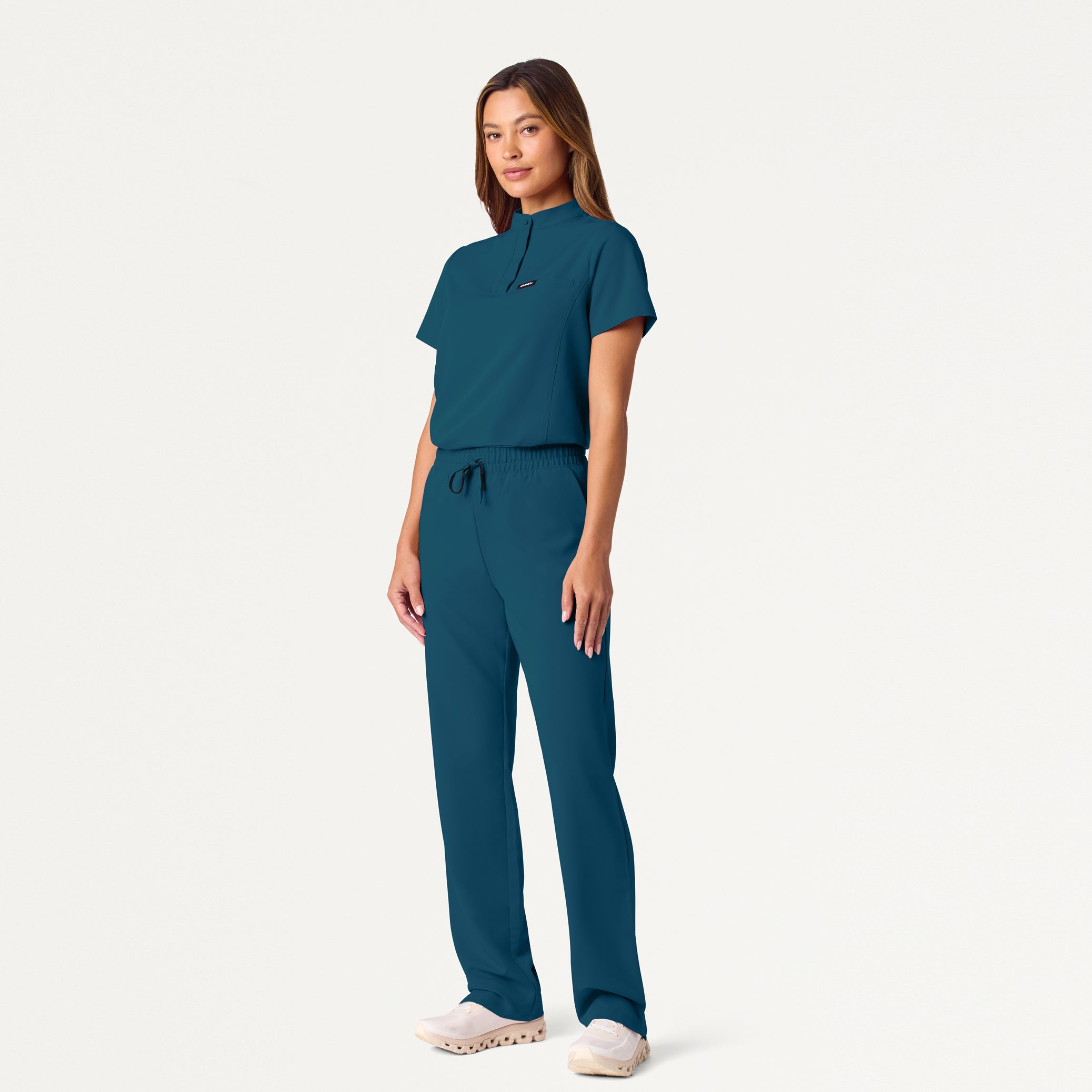 Woman wearing Caribbean Blue scrub set