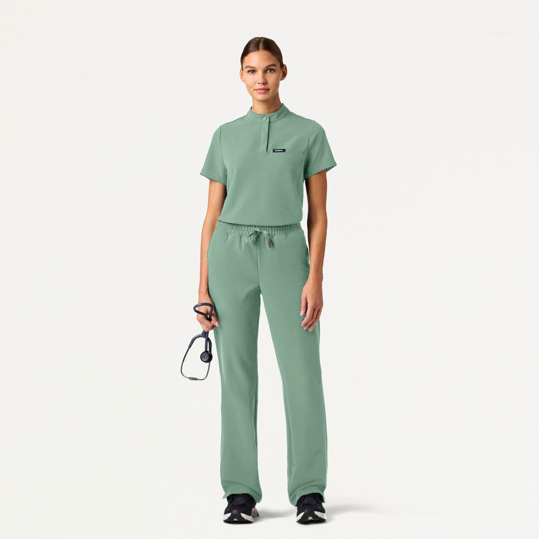 Woman wearing Sage scrub set