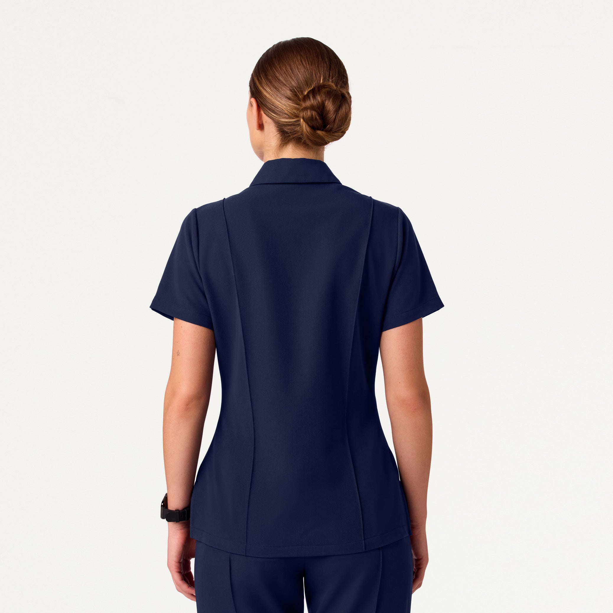 Woman in midnight navy scrub set