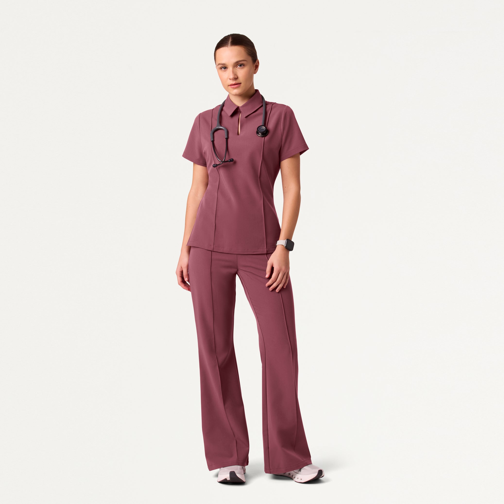 Woman wearing Rosewood scrub set