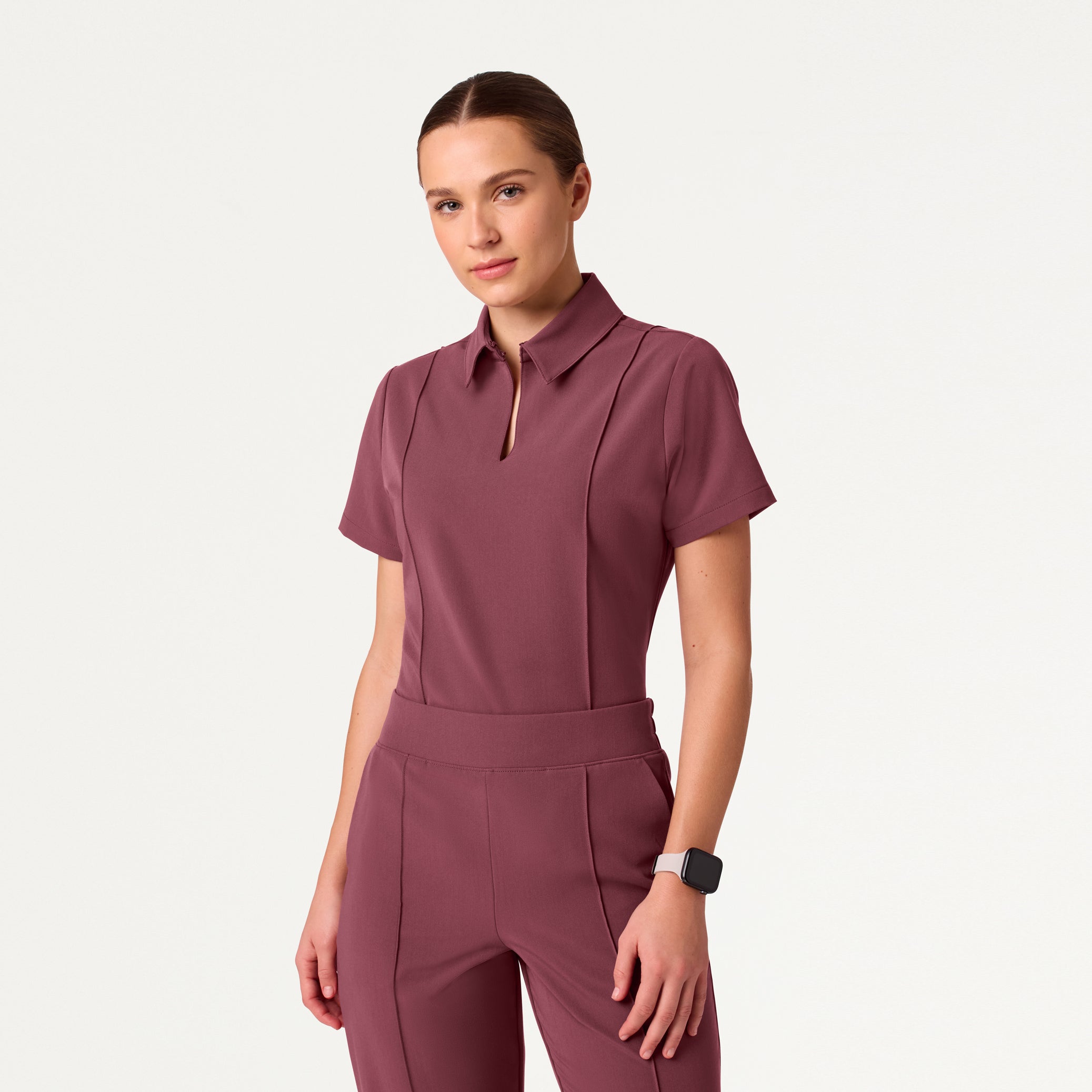 Woman wearing Rosewood scrub top