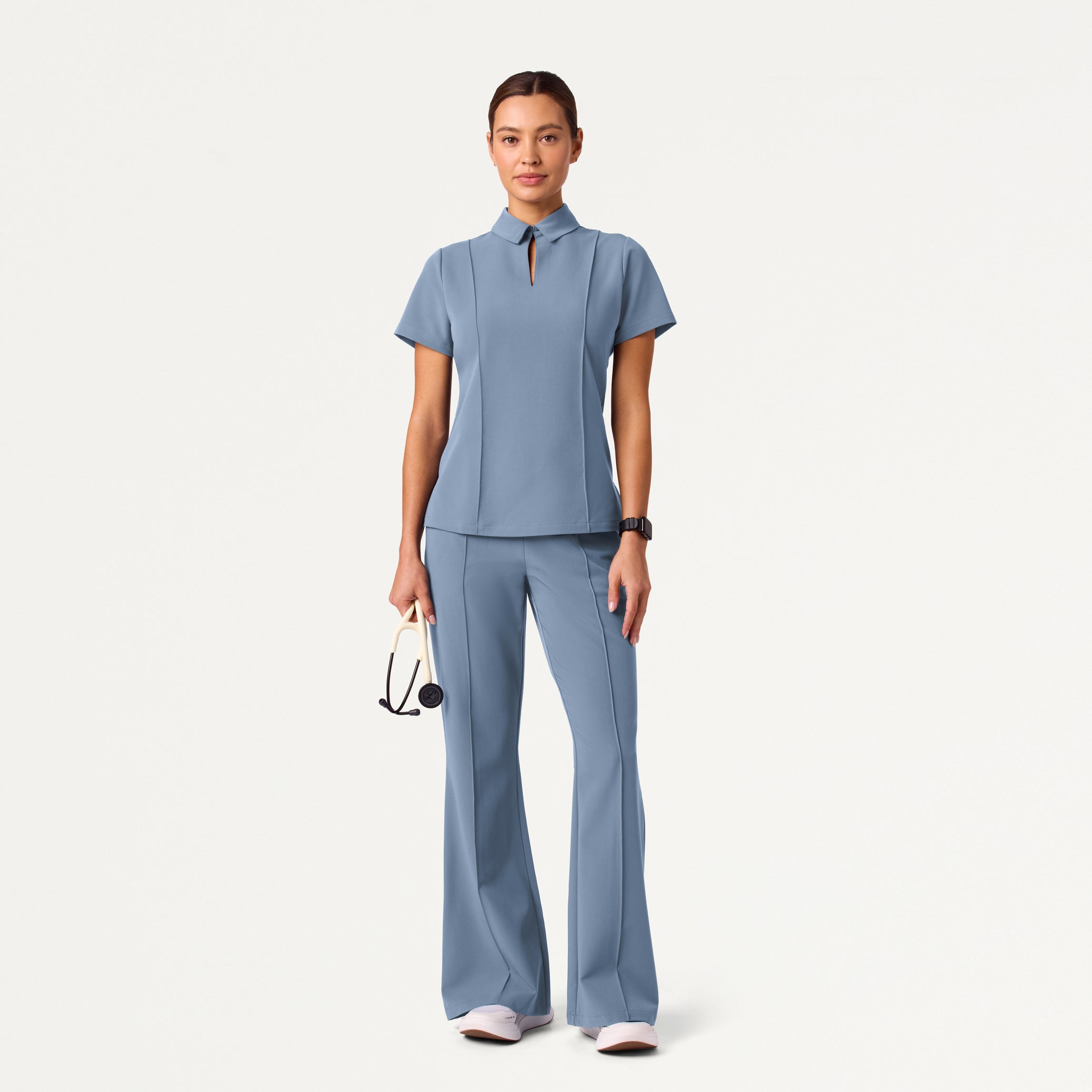 Woman wearing Storm Blue scrub set