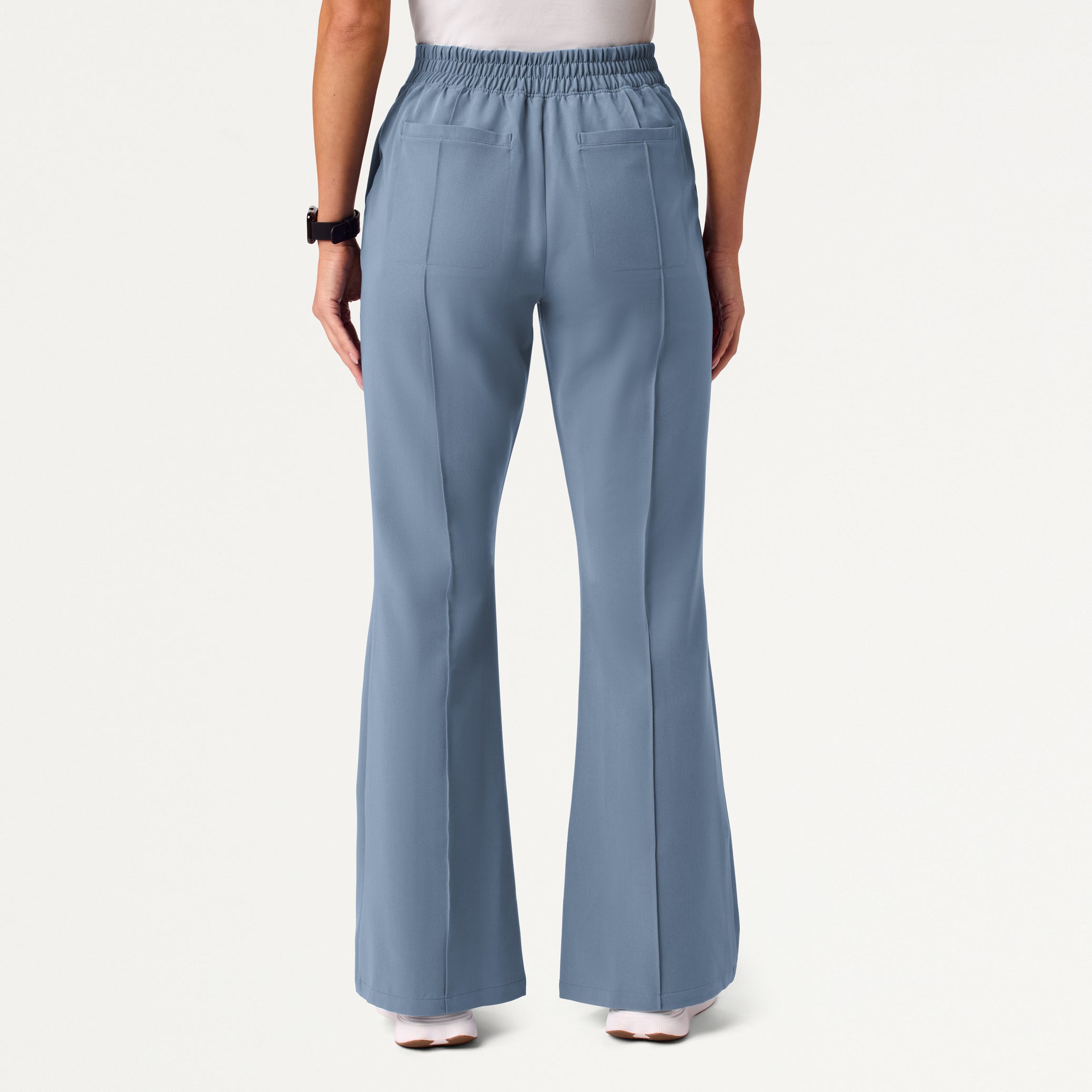 Woman wearing Storm Blue scrub pant